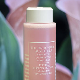 Sisley Paris product in use on cotton pad demonstrating gentle removal