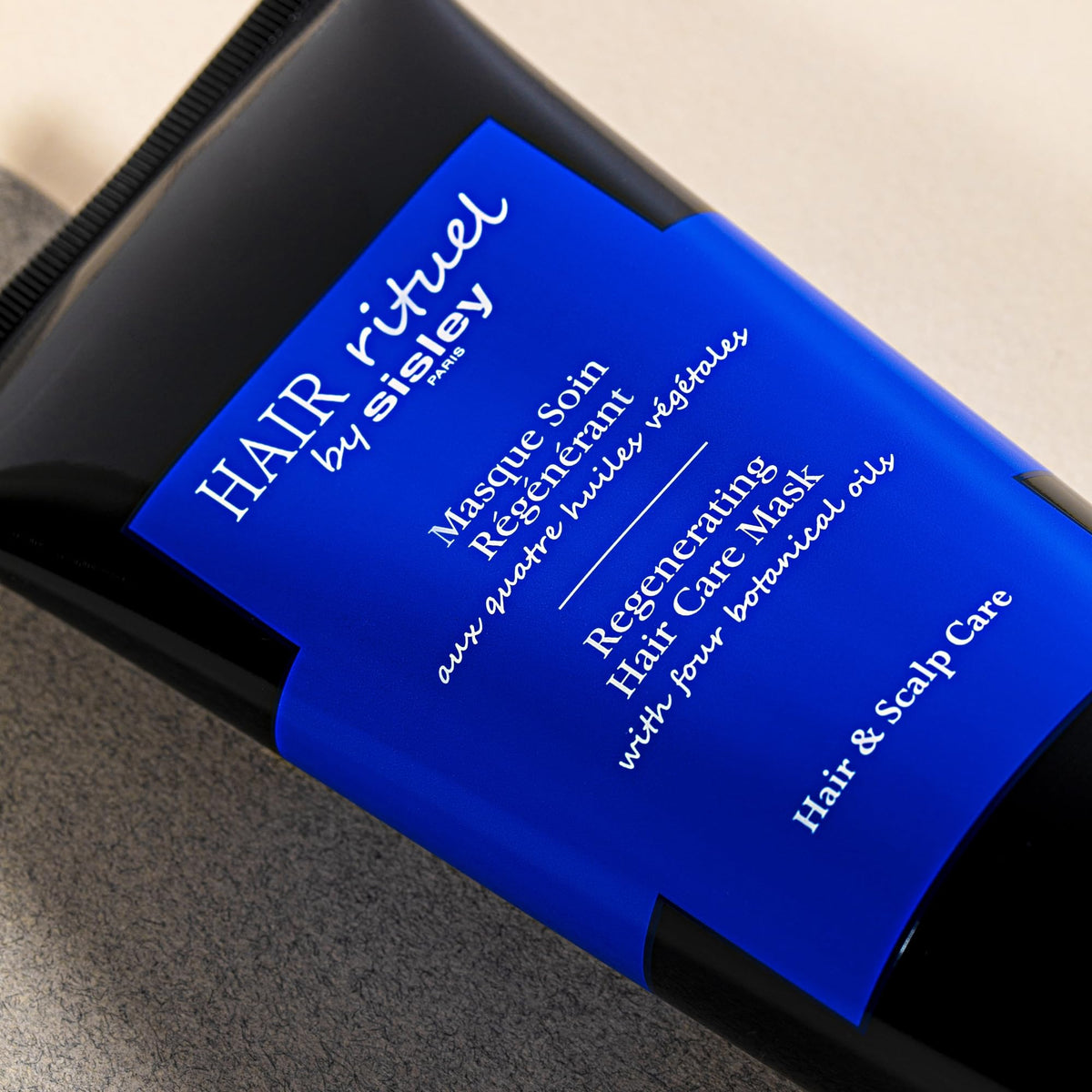 Sisley Paris mask applied during scalp massage, demonstrates nourishment and stimulation