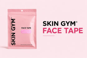 SKIN GYM tape next to hand for scale showing compact pack convenience