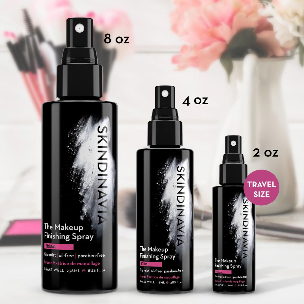 SKINDINAVIA bottle next to a hand to show compact 4 oz size benefit-portable for kits