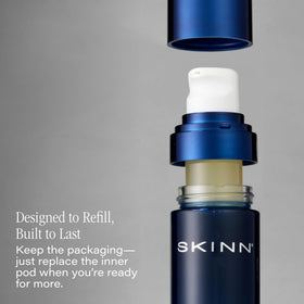 SKINN serum applied in morning near mirror, indicates easy layering under makeup