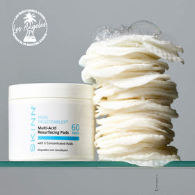 SKINN pads displayed on bathroom vanity suggesting effortless nightly resurfacing routine