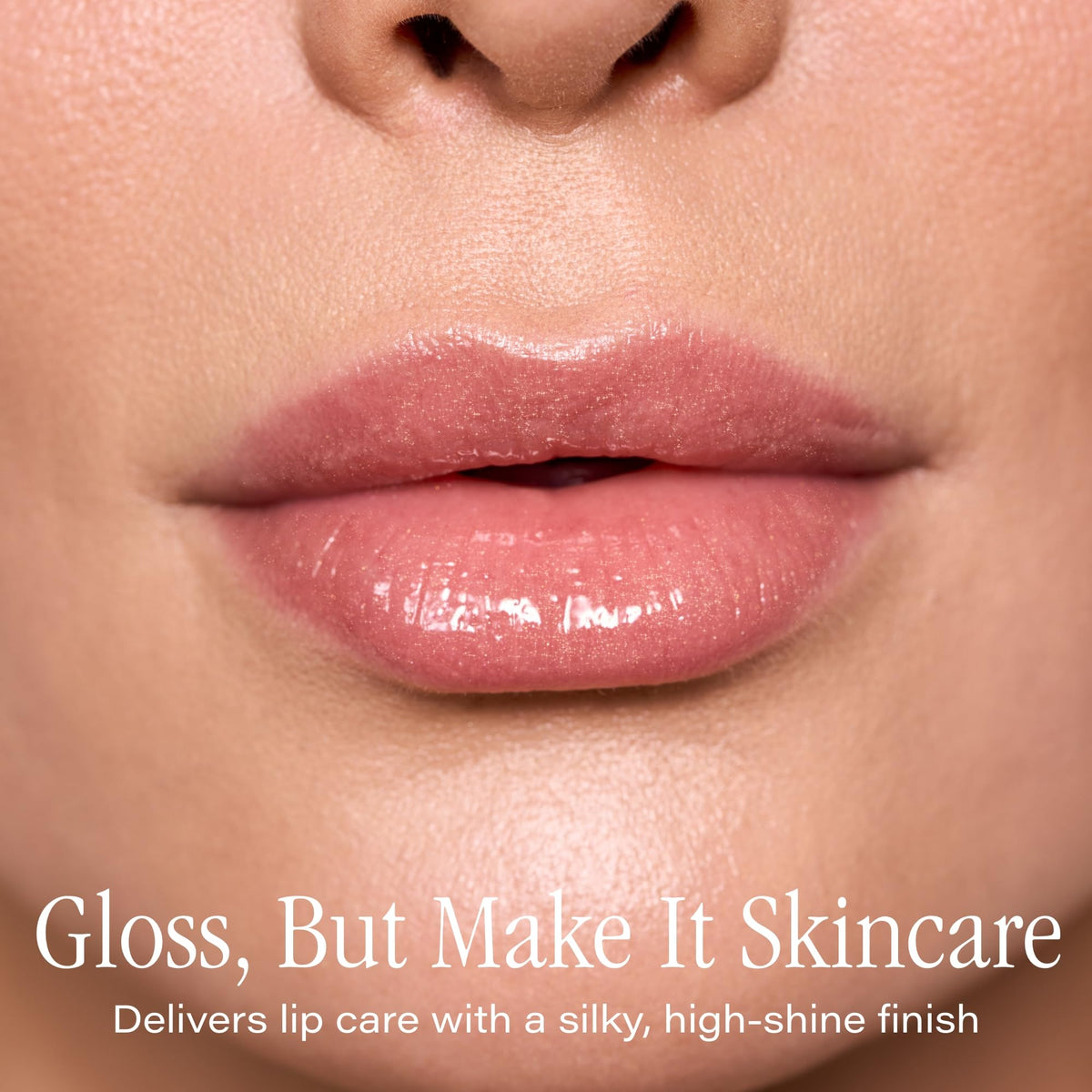 SKINN wand applicator close-up illustrating creamy, non-sticky gloss texture