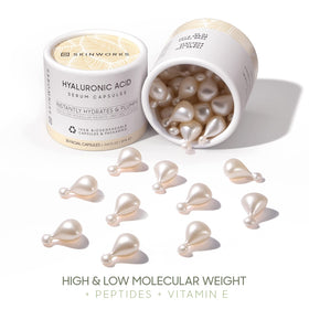 SKINWORKS size comparison next to coin showing portable capsule dimensions