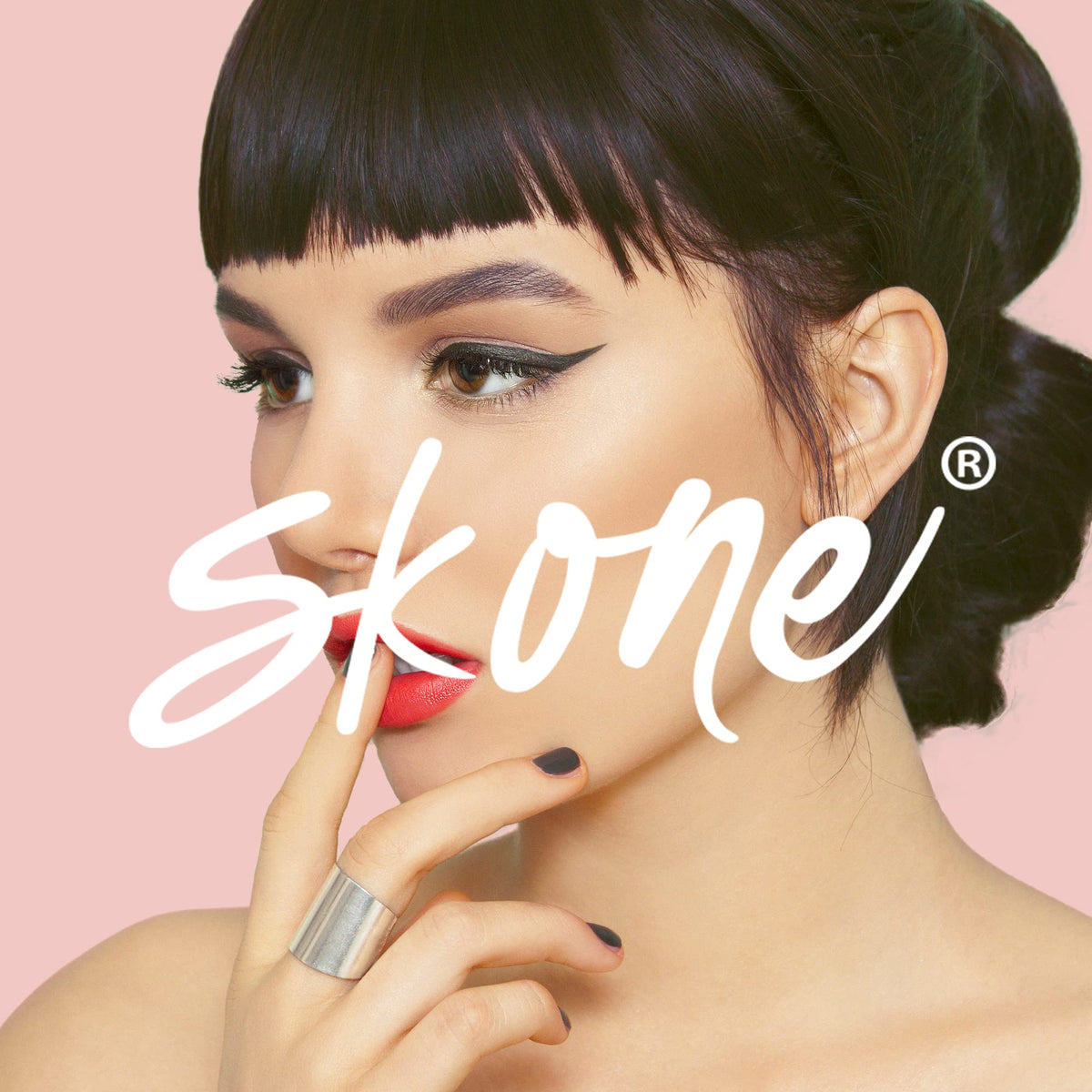 Skone pen next to coin illustrating compact size for easy travel