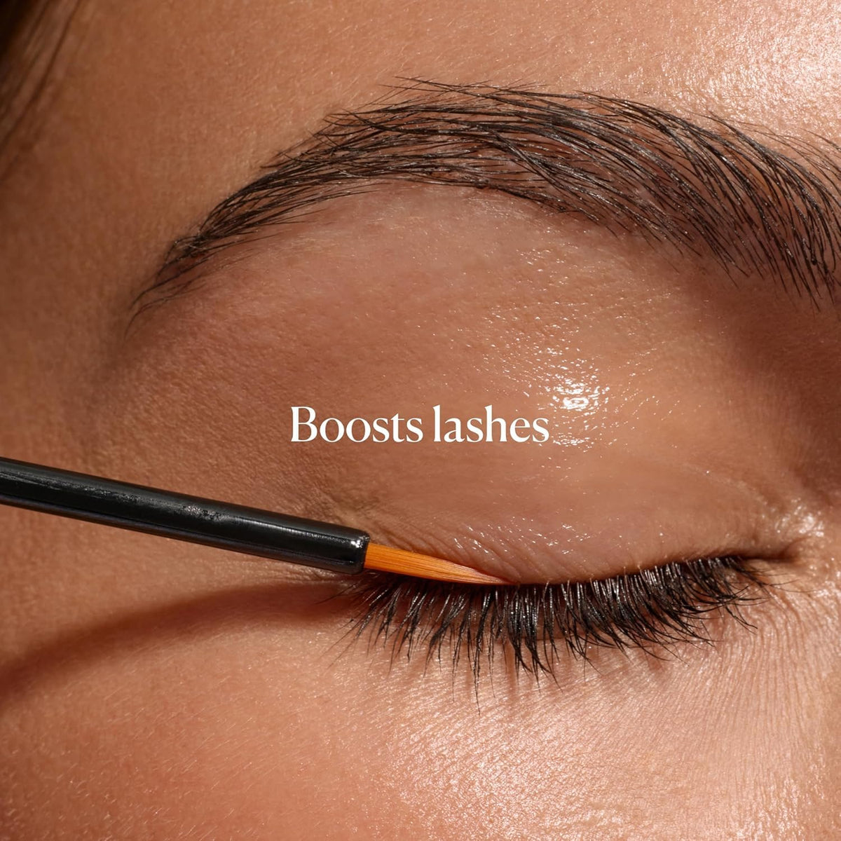 Sky Organics dropper dispensing a clear castor oil drop for precise nightly application