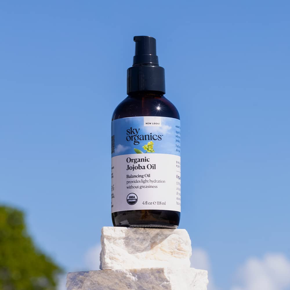 Sky Organics jojoba oil in bathroom lifestyle setup conveying everyday routine use