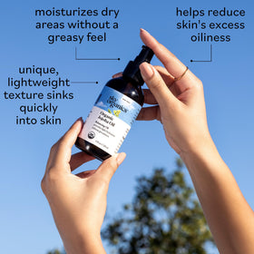 Sky Organics jojoba oil applied on hand showing quick hydration benefit