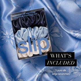 SLIP indigo scrunchie in hand showing size and comfortable scale