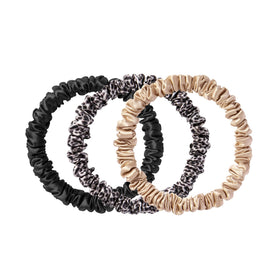 SLIP front packaging of three silk skinny scrunchies showing colors and benefits