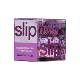 Hand holding SLIP scrunchie to show size and discreet, low-profile scale