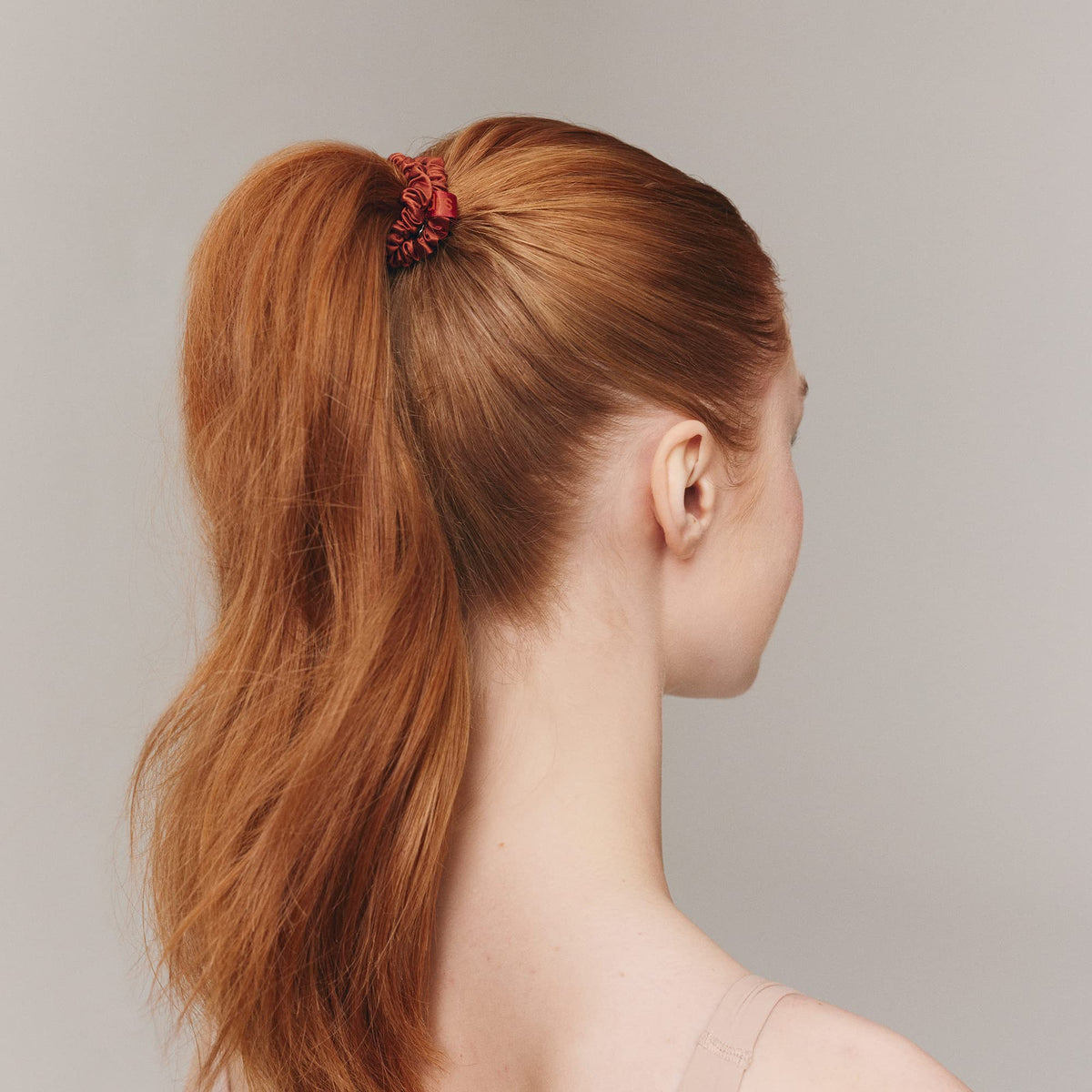 SLIP scrunchie worn on wrist for styling convenience and no-hassle storage