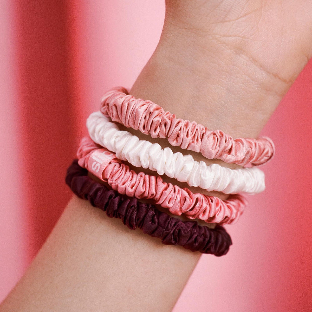 SLIP crimson scrunchie displayed solo, rich color and gentle hold