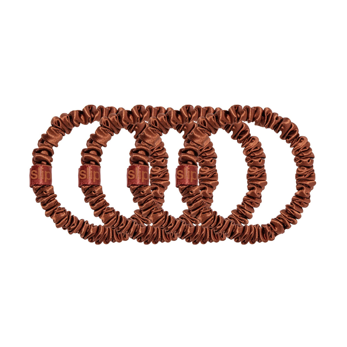 SLIP set of four auburn scrunchies neatly arranged showing color coordination benefit