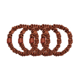 SLIP set of four auburn scrunchies neatly arranged showing color coordination benefit