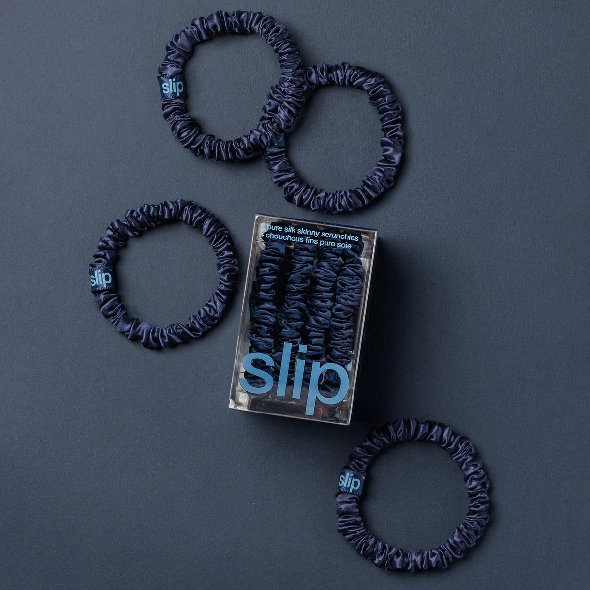 Slip silk scrunchie worn on wrist demonstrating stylish convenience and gentle hold