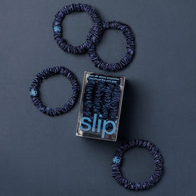 Slip silk scrunchie worn on wrist demonstrating stylish convenience and gentle hold