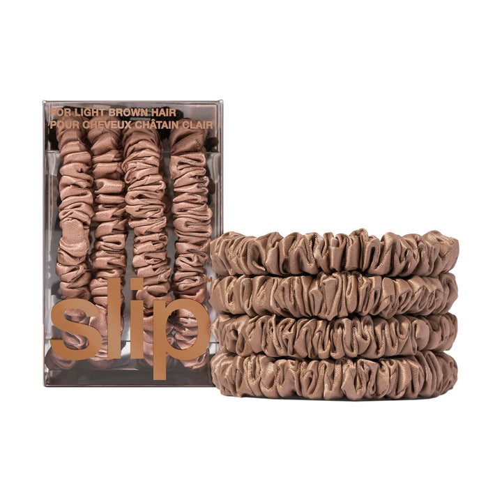 Slip front packaging showing four light brown silk scrunchies, luxe presentation benefit