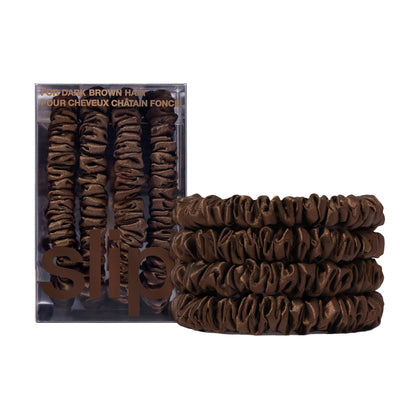 SLIP front packaging showing four dark brown silk skinny scrunchies and elegant box