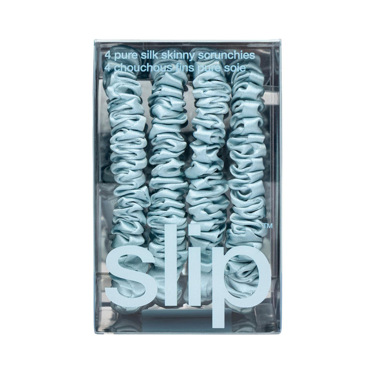 SLIP scrunchie on nightstand suggesting sleep-friendly, crease-reducing benefit