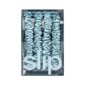 SLIP scrunchie on nightstand suggesting sleep-friendly, crease-reducing benefit