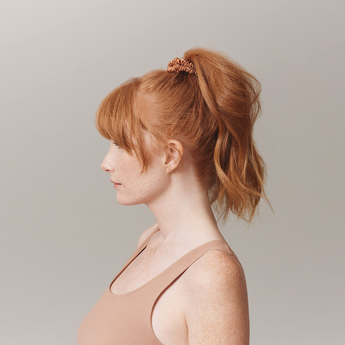 SLIP skinny scrunchie worn on wrist for convenient storage and gentle hold