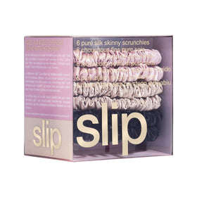 SLIP scrunchie on hand for scale, slim profile shows discreet size