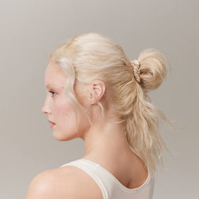 SLIP slim scrunchie worn on wrist showing discreet styling and convenience