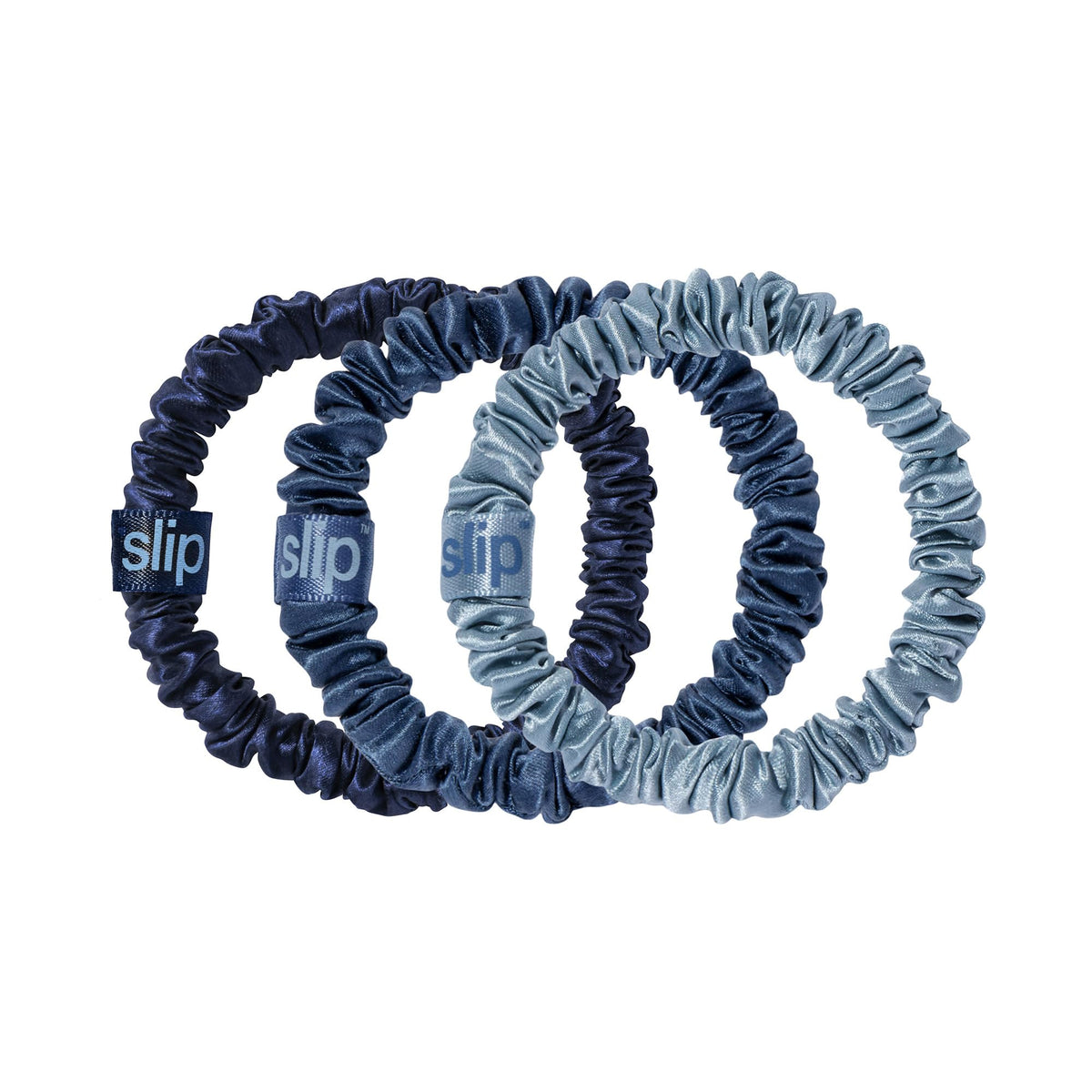 SLIP trio flat lay of sapphire oxford navy scrunchies showing coordinated colors and gentle hold