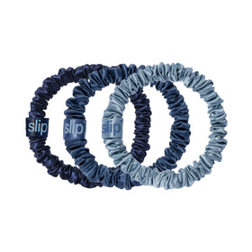 SLIP trio flat lay of sapphire oxford navy scrunchies showing coordinated colors and gentle hold
