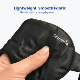 Slumbriq on model lying down illustrating restful blackout comfort