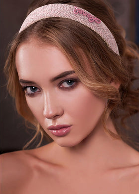 Sluxa pink headband close-up texture highlighting soft comfortable fabric