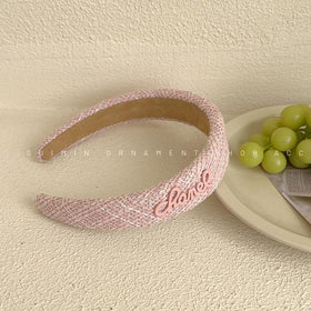Sluxa pink headband worn by model showing polished hairstyle and hold