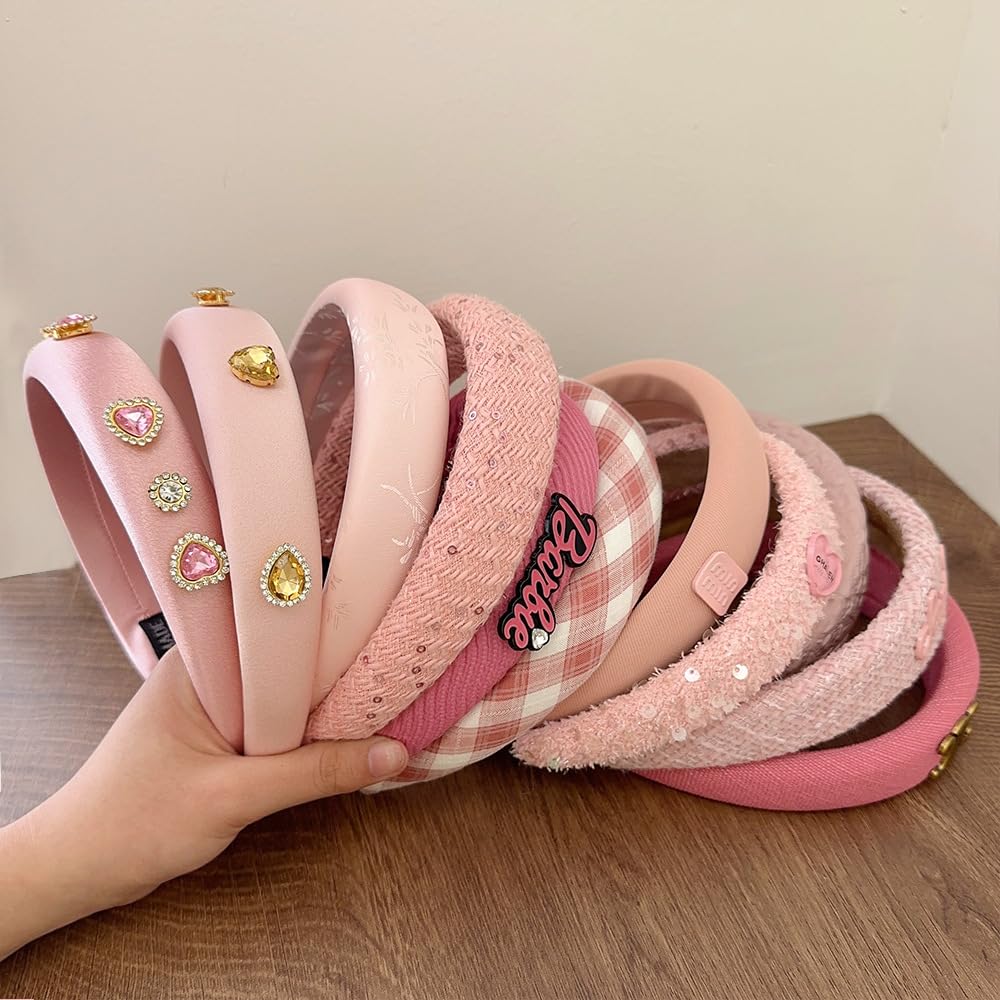 Sluxa pink headband next to ruler showing scale and everyday practicality