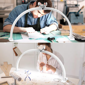 SLYFTE size comparison with hand under light showing broad shadow-free workspace