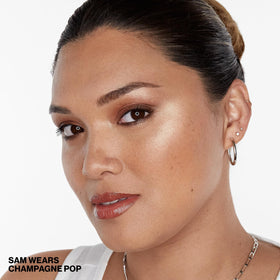 Smashbox x BECCA being applied to cheekbone showing immediate lifted radiance
