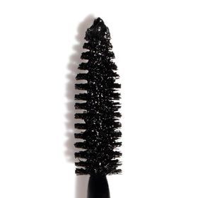 Smashbox tube held in hand showing compact 0.38 fl oz size for travel convenience