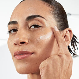 Smashbox bottle beside foundation illustrating primer creates smooth base for makeup