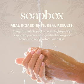 Coconut and sandalwood ingredients beside Soapbox bottle highlighting natural scent notes