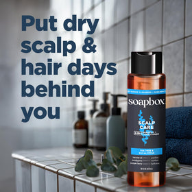 Soapbox scalp care held in hand for scale to show travel-friendly size