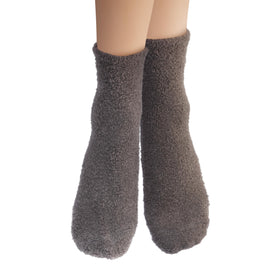 Earth Therapeutics socks paired with foot lotion showing overnight hydration routine