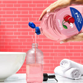Softsoap pouring refill into dispenser for convenient use