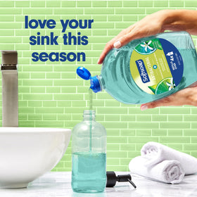 Softsoap 50 oz bottle beside common household item for size and long-lasting benefit