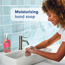 Softsoap bottle in use washing hands to remove dirt and refresh skin