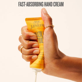 Sol de Janeiro being applied on hands for soft, non-greasy feel