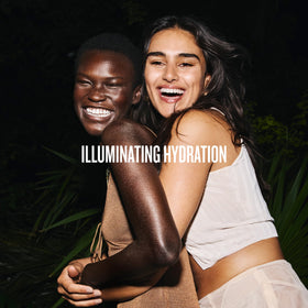 Sol de Janeiro lifestyle image on beach illustrating holiday-ready glow