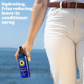 Solar Recover in use on beach models detangling sun-exposed hair quickly