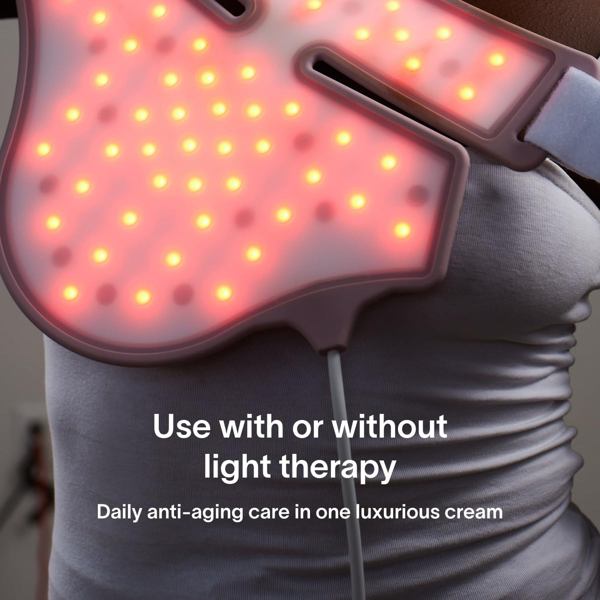 Applying Solawave cream to neck and chest illustrating targeted firming benefit