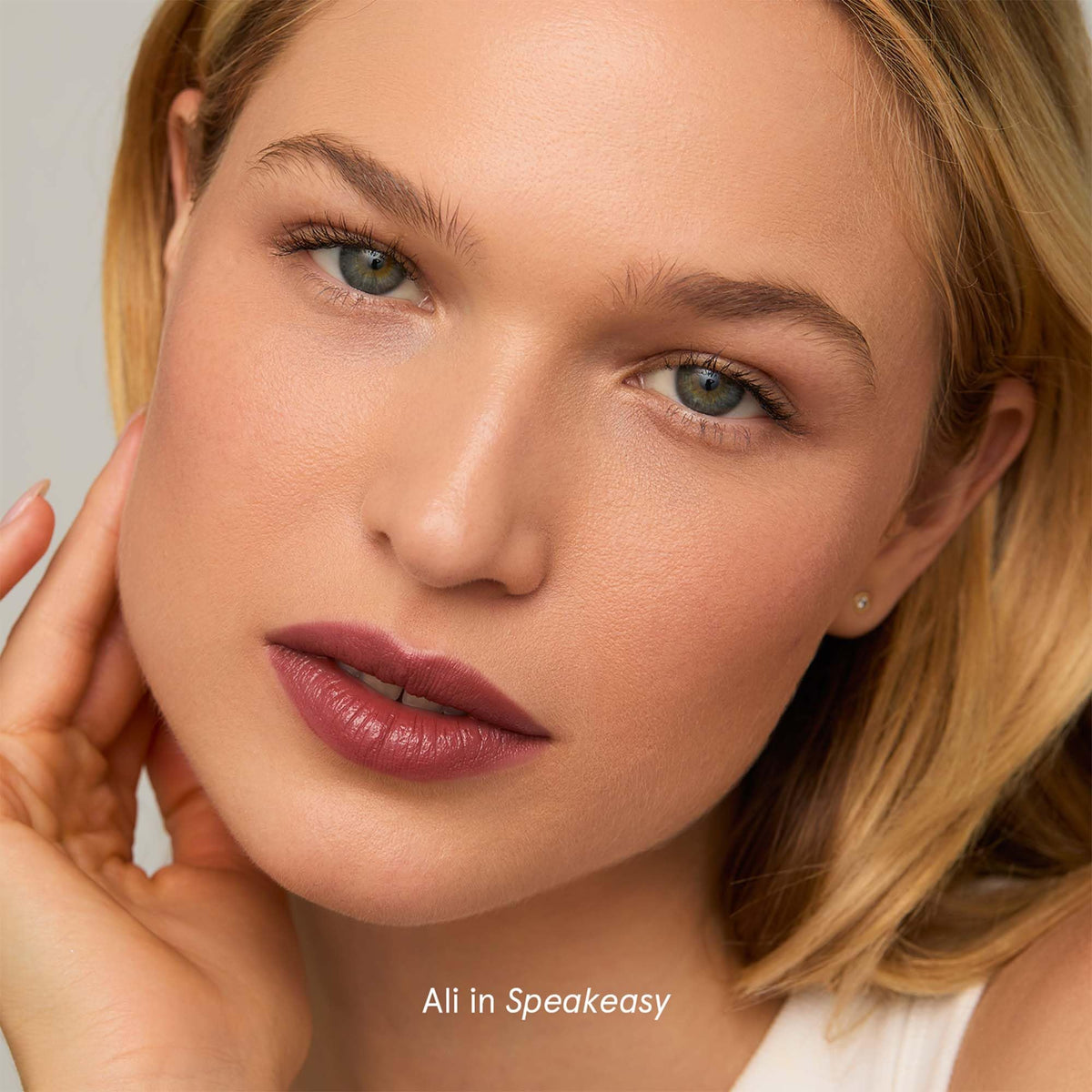 Woman wearing SOSHE Lip Silk Speakeasy in casual setting illustrating natural everyday look