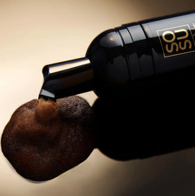 SOSU application with tanning mitt on leg, shows even streak-free finish benefit